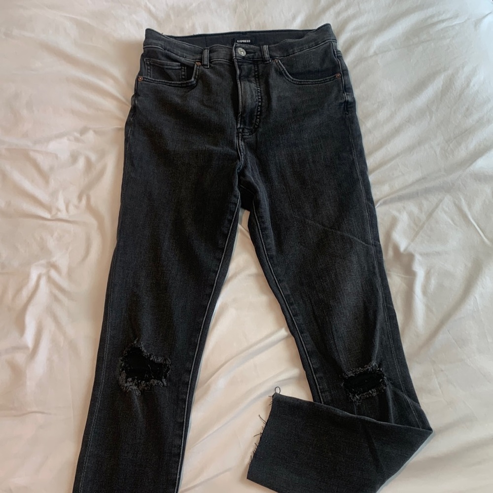 Express black distressed denim.